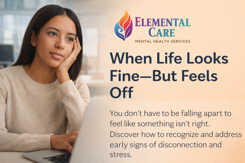 Woman sitting at a desk looking thoughtful and mentally fatigued, representing feeling off despite functioning in daily life